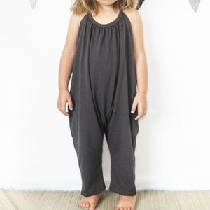 Gray slouchy, backless jumpsuit with halter tie.